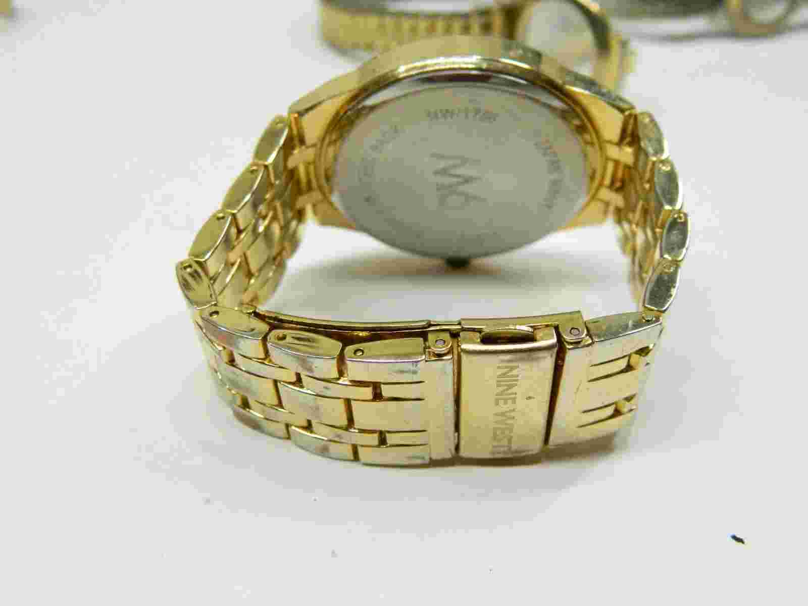 Large face Nine West Black on gold tone Lady's watch