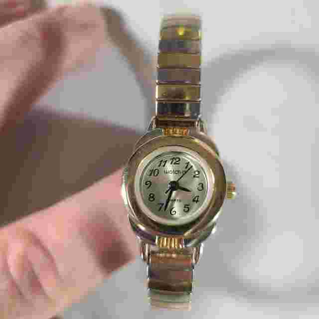 Watch It Quartz Gold Toned Watch Mother of Pearl Face Black 2nd Hand & Hands