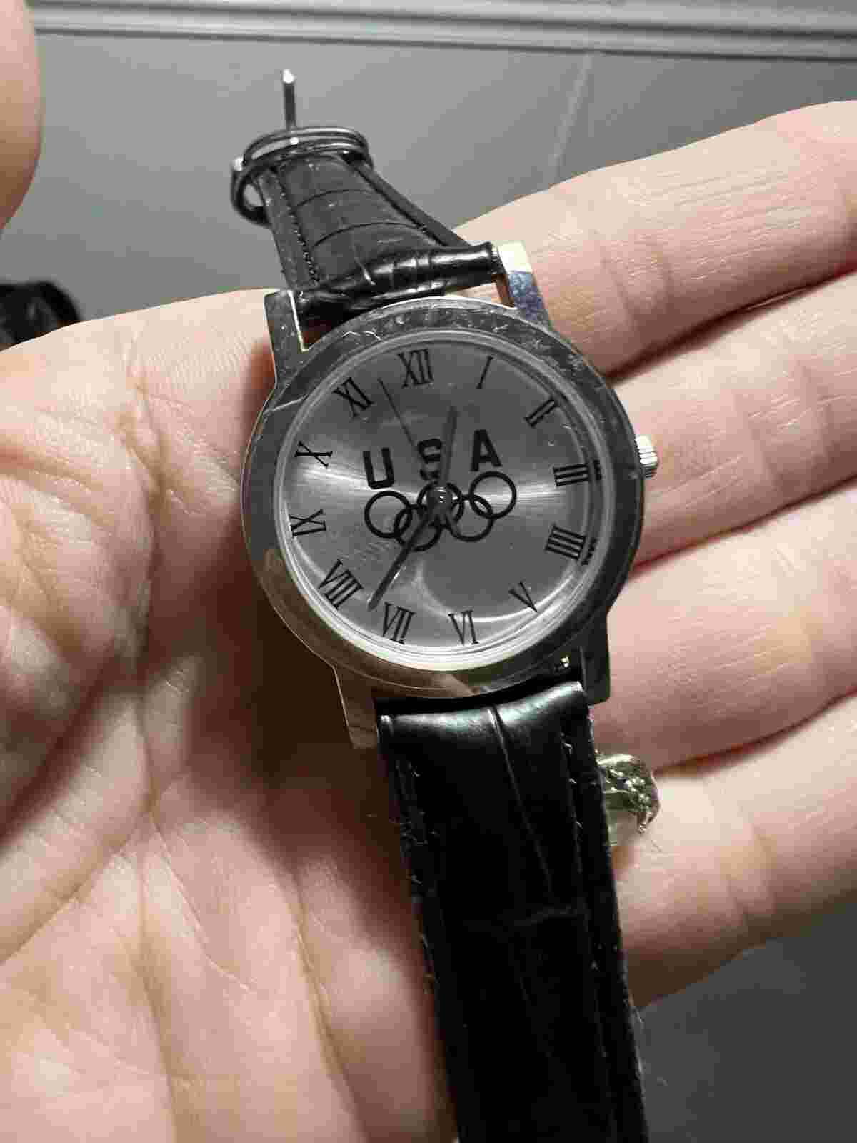 USA Watch, with Olympic logo in silver, new battery never worn ladies