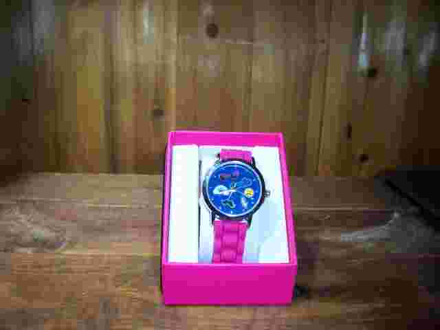 LADIES SMILE DESIGN WRISTWATCH 1 1/4 INCH FACE SILVER COLORED TRIM  PINK BAND