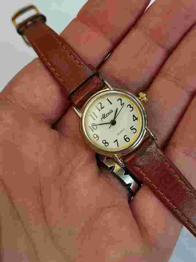 Alexis women's quartz gold tone leather strap wristwatch