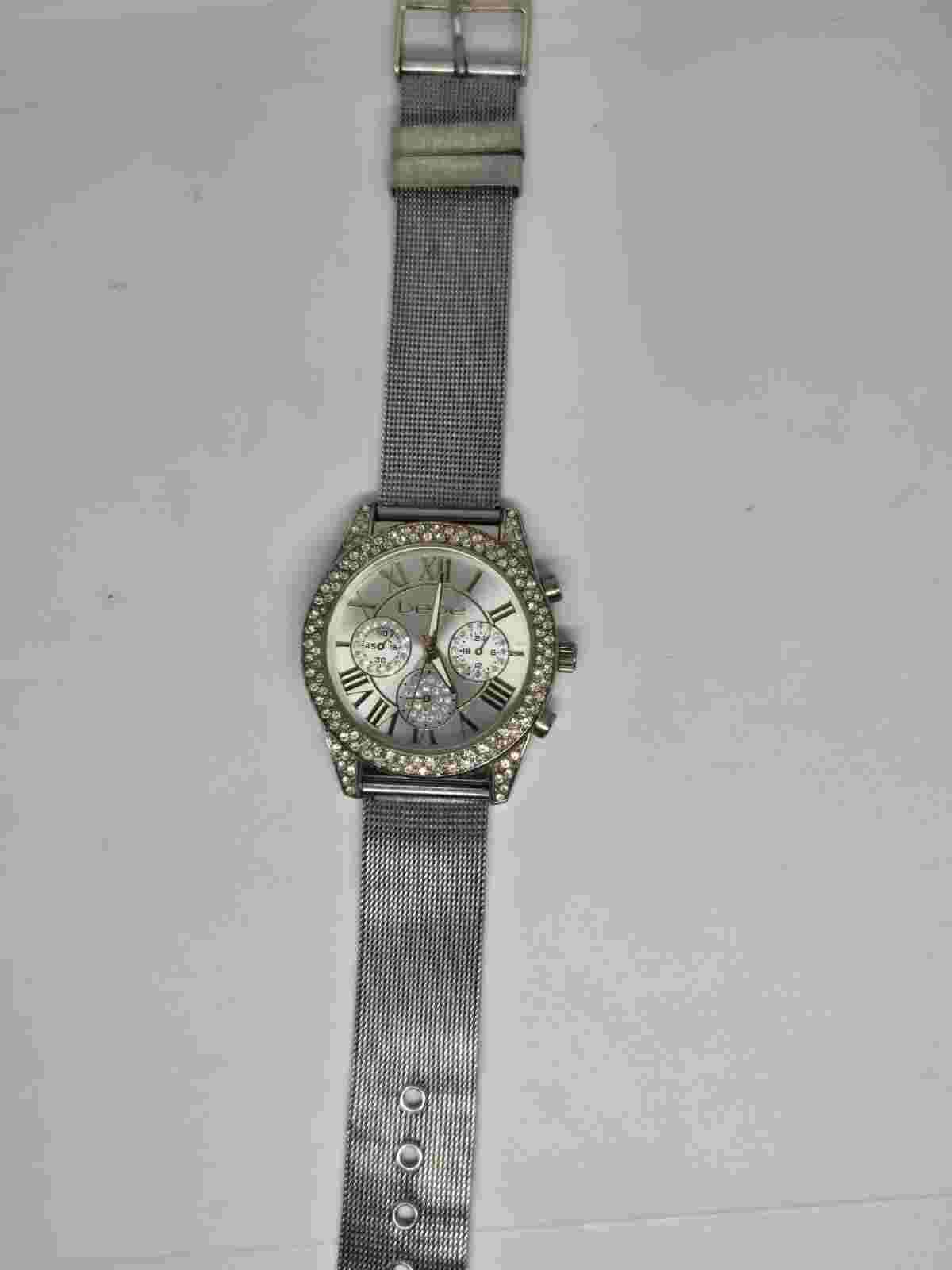 Bebe Ladies' Silver/Gold Toned Rhinestone Analog Watch. New battery.