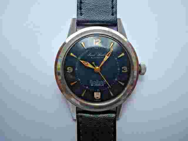 Paul Buhre Mens Automatic SS Watch 21j. Black Dial Red Date  New Band Runs As Is
