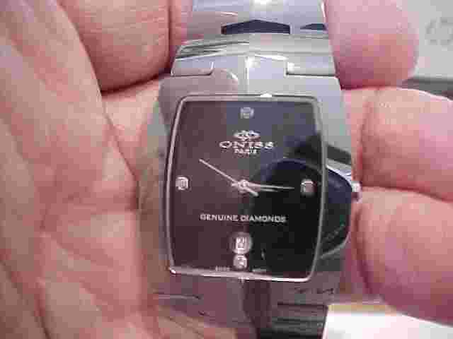 NICE USED ONISS BRAND MANS WATCH TUNGSTEN CASE ON329.1M