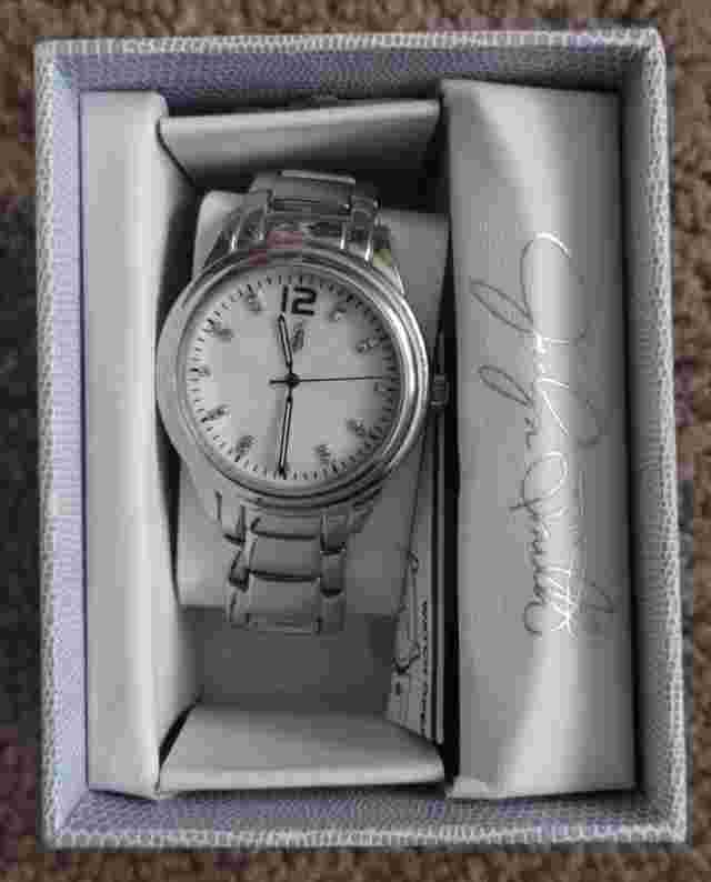 Jaclyn Smith Ladies Round Gold Tone Analog Wristwatch w/ Silver Tone Metal Strap