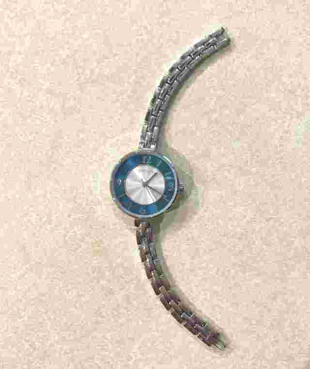 Chico's analog watch with silver tone link band, silver and turquoise face
