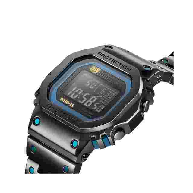 Casio G-Shock
                           
                                 Blue Ink Ref. MRG-B5000BA-1DR Black Dial Black Steel Bracelet