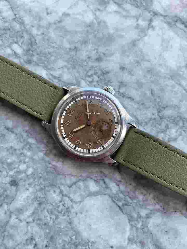 Mido Multifort
Multisport Vintage 40s Manual Wind Silver Patina Dial Sub Seconds 34mm Case.