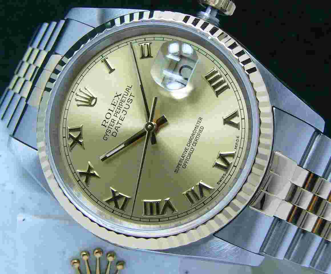 Rolex Datejust 36
1994 Datejust 36 Boxes Papers Champagne Roman Numeral Dial Fluted Bezel 16233