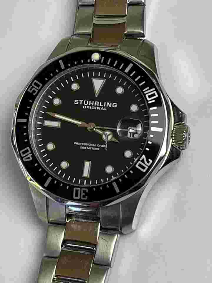 Stuhrling
Original Professional Diver 200Meters Magnifier Date Black Dial Screw Down Case Back
