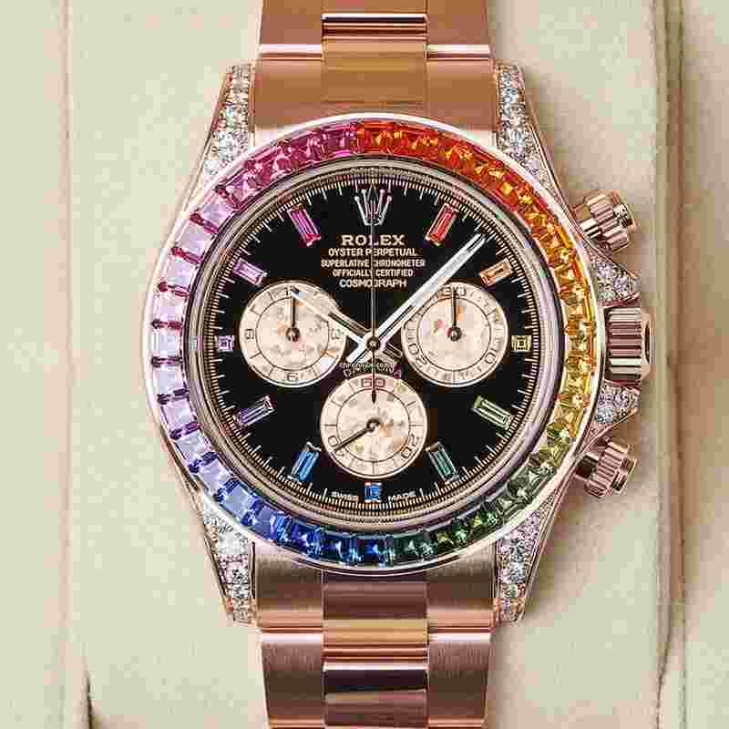 Rolex Daytona
                           
                                 Cosmograph Daytona 40mm Rainbow Sapphire Bezel Everose Gold Black Diamond Baguette Dial