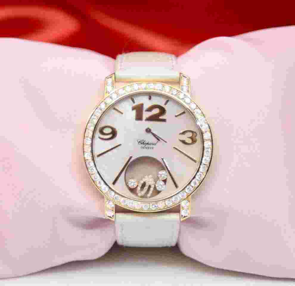 Chopard Happy Diamonds
18K Yellow Gold Watch w/Diamonds; floating diamonds 4176