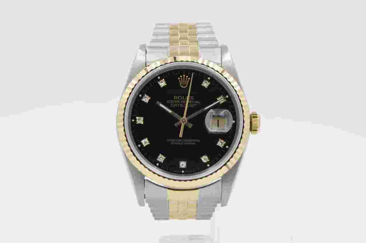 Rolex Datejust 36
16233 black factory diamond dial 36mm 18k yellow gold 1991 with B&P