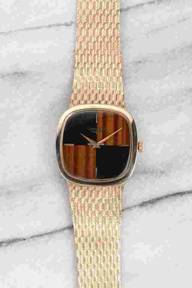 Longines
Vintage 70s 14K Yellow Gold Manual Wind Onyx & Tiger Eye 30mm Case.