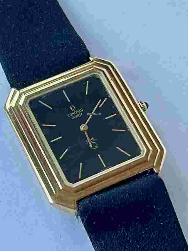 Concord
                           
                                 Nine Quartz Classic Dress Solid 14K Gold Blue Sapphire Crown Ultra Thin Swiss Made