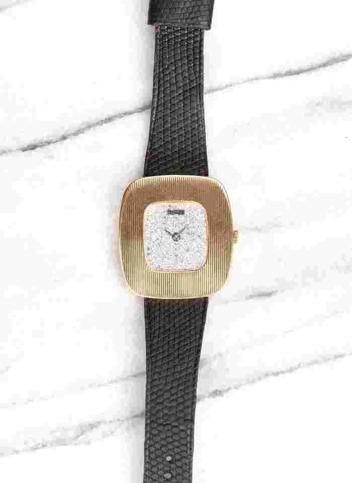 Piaget
Reference 99022 Vintage 1980s Manual Wind 18K Yellow Gold Diamond Pave Dial.