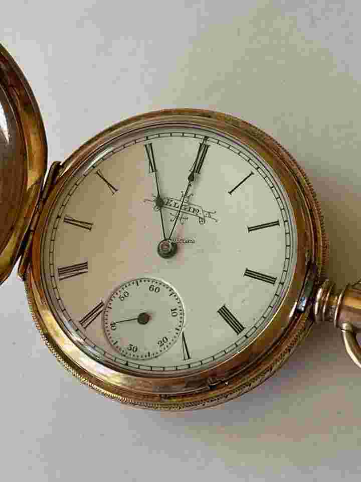 Elgin
Solid 10K Gold Hunter Pocket Watch Porcelain Dial Roman Numbers Antique FOB Chain Slider