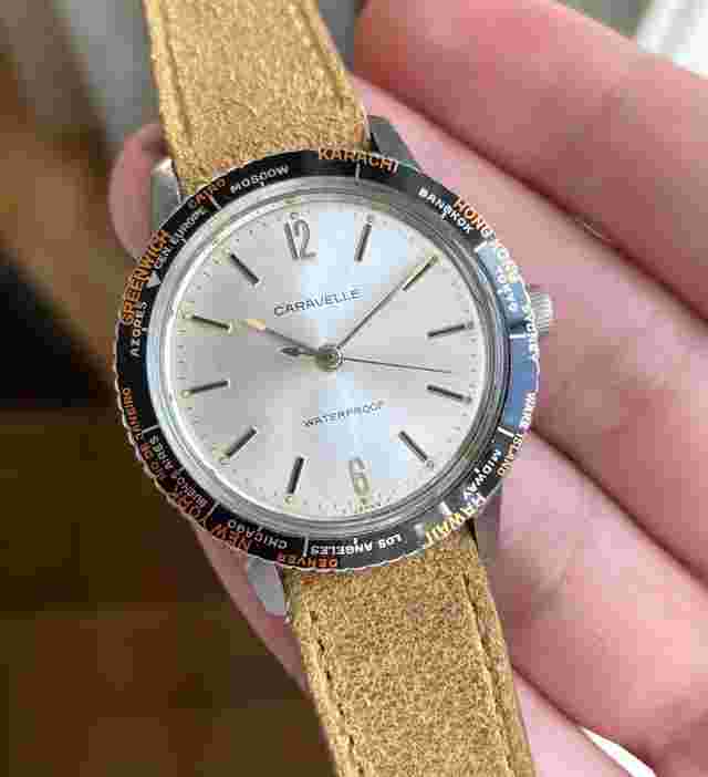 Vintage Caravelle World Time Manual Wind Silver Sunburst Dial Chrome Case Watch