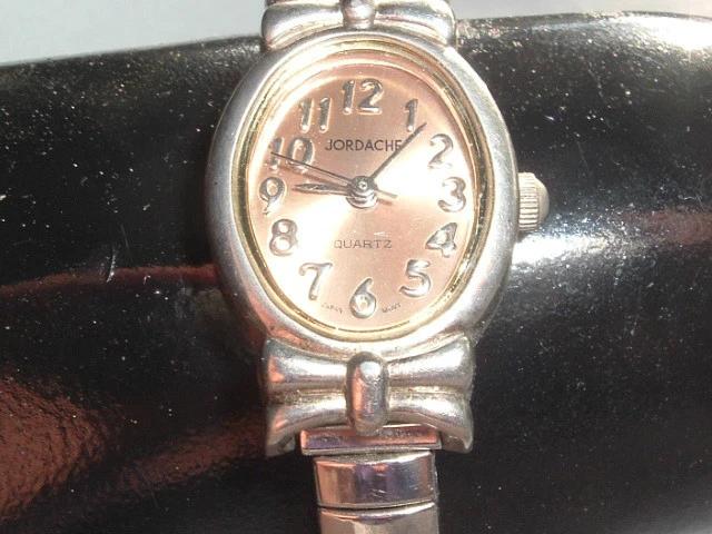 VINTAGE JORDACHE QUARTZ STAINLESS STEEL STRETCH BAND WRIST WATCH