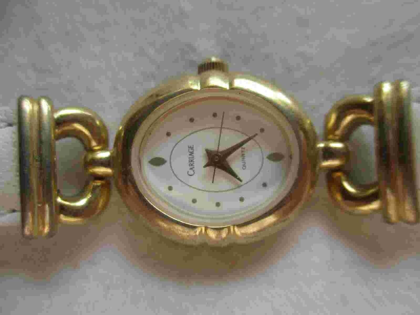 Carriage Analog Wristwatch White Buckle Band Oval Shaped Face Gold Tone