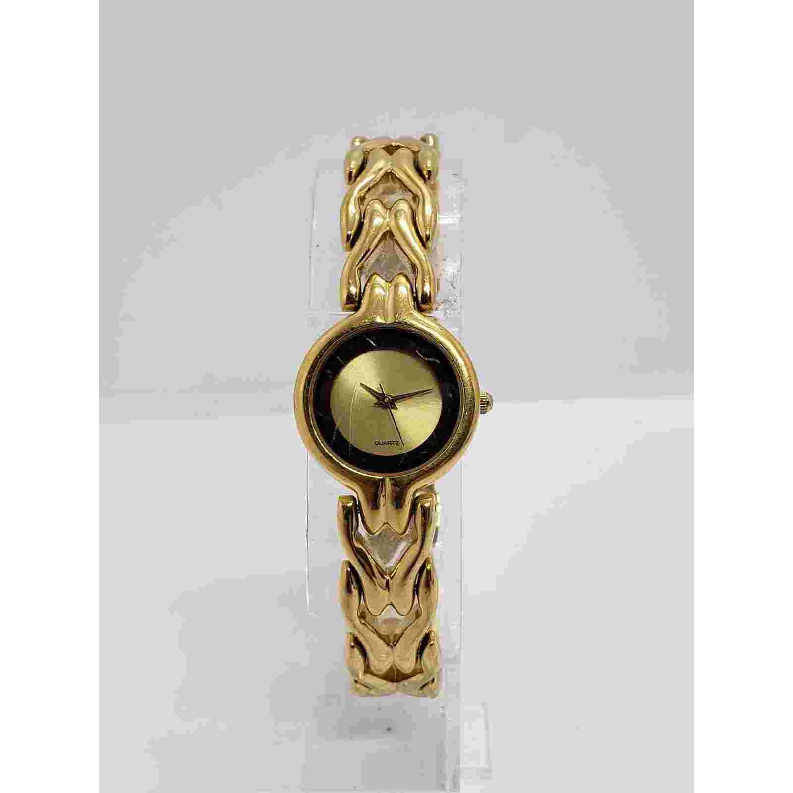 Paolo Gucci women's watch. Small gold face with black accent. Working watch