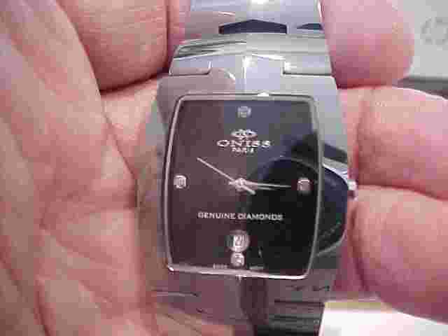 NICE USED ONISS BRAND MANS WATCH TUNGSTEN CASE ON329.1M