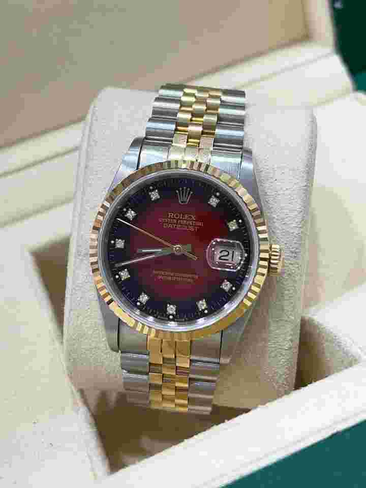 Rolex Datejust 36
Steel And Yellow Gold Jubilee Bracelet Red Diamond Dial Box And Papers 16233