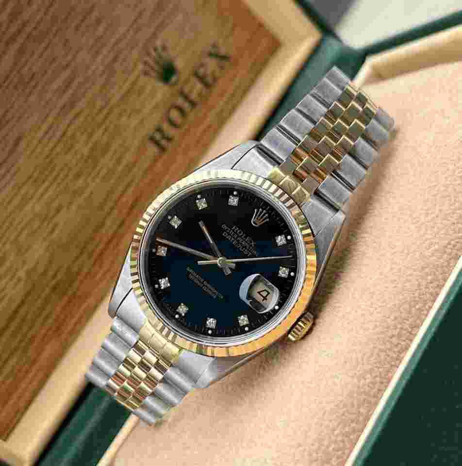 Rolex Datejust 36
Gents Steel And Yellow Gold Factory Black Diamond Dial Box And Papers 16233