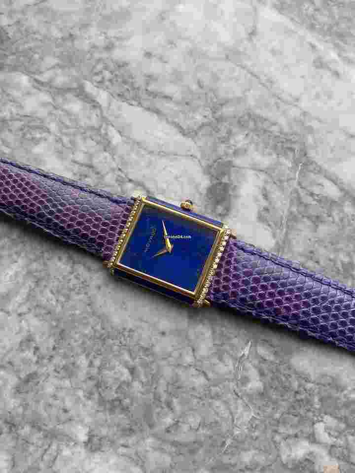 Movado
Vintage Manual Wind 1980s 18K Yellow Gold Blue Lapis Dial Diamond Tank 25mm Case.