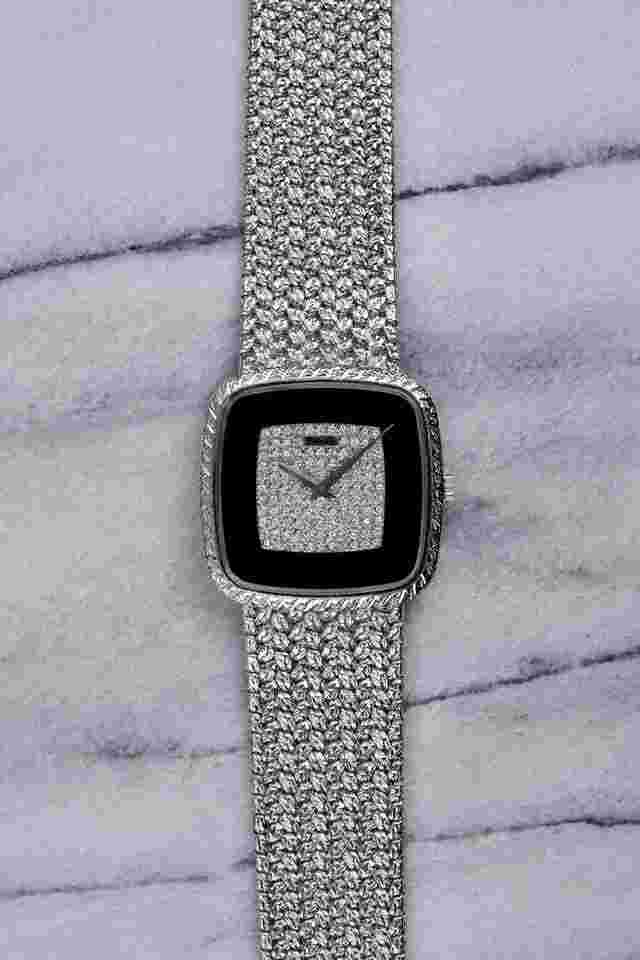 Piaget
Vintage 70s Reference 9771 18K White Gold Manual Wind Onyx Diamond Dial 32mm Case.