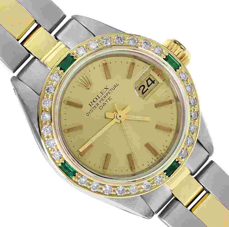 Rolex Oyster Perpetual Lady Date
Ladies Two Tone Date 26MM Champagne Index Dial 18K Yellow Gold Diamond Emerald Bezel Watch
