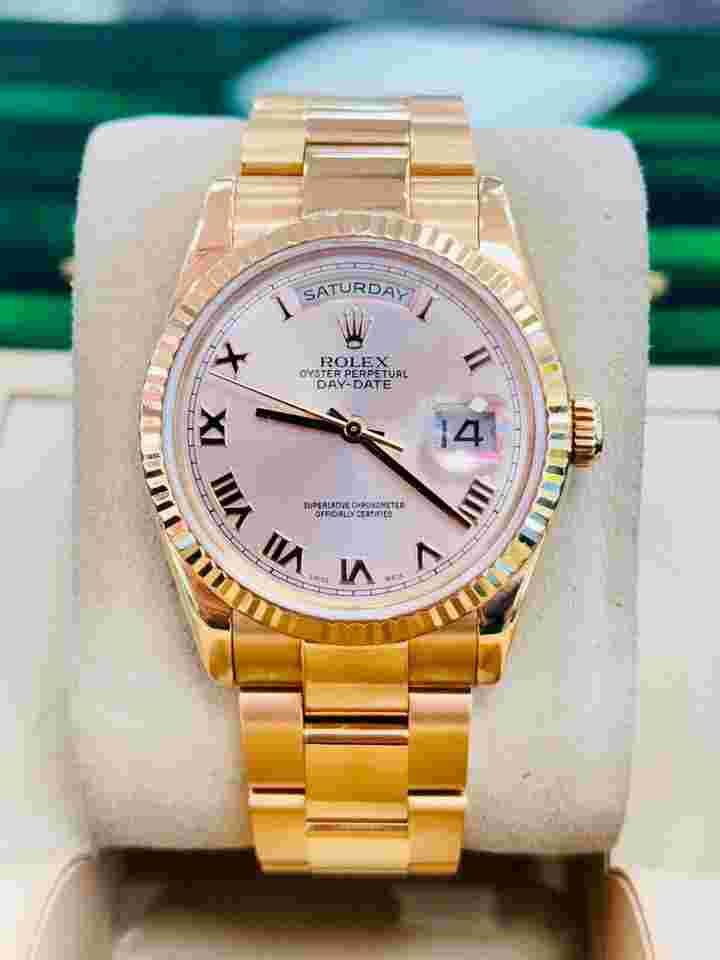 Rolex Day-Date 36
118235 18K Rose Gold Pink Roman Dial Oyster Bracelet Box and Papers Preowned