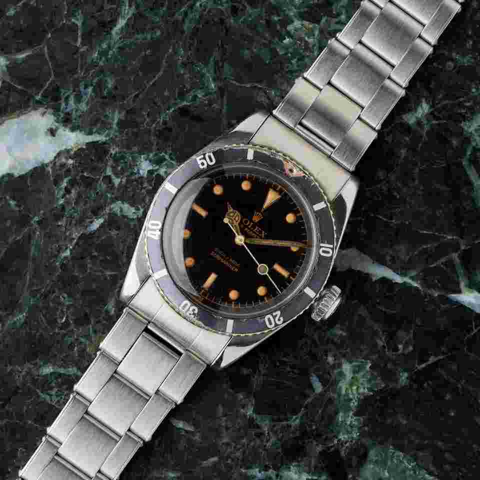Rolex Submariner (No Date)
6538 "Coroncione" - Radium Gilt Dial - Red Triangle Bezel - Excellent Condition